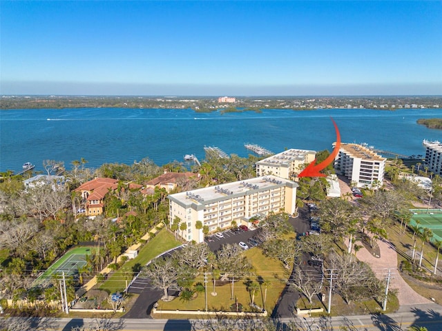 birds eye view of property featuring a water view