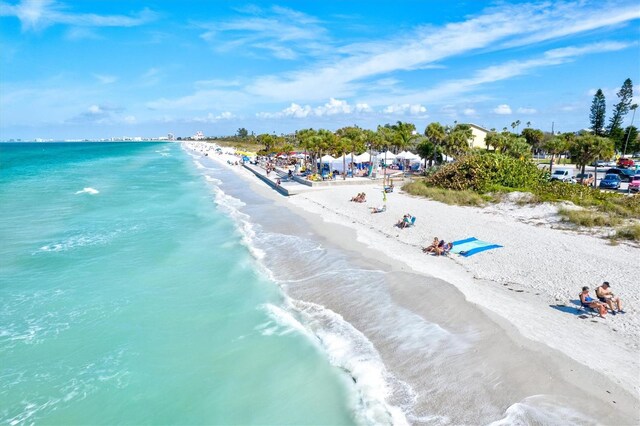 bird's eye view with a view of the beach and a water view