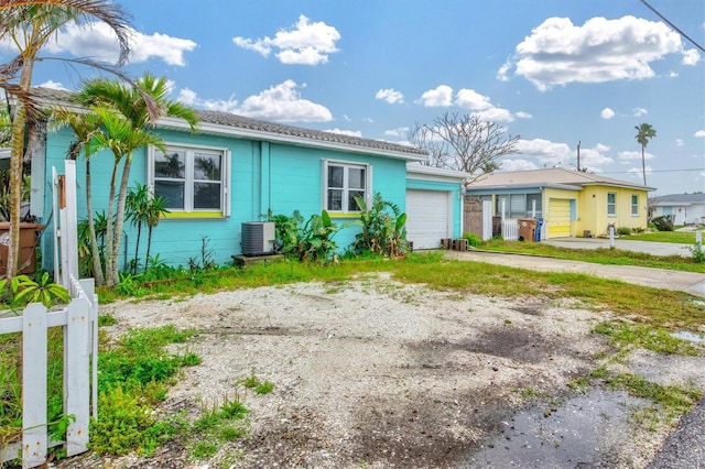 256 144th Ave, Madeira Beach, FL 33708 - ranch-style home featuring an attached garage, driveway, and concrete block siding