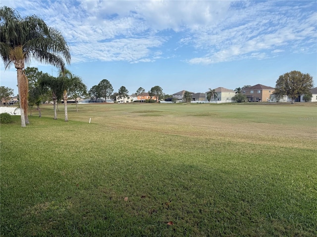 surrounding community featuring a residential view and a lawn