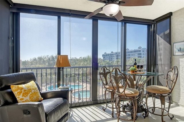 sunroom / solarium featuring wood finished floors and plenty of natural light