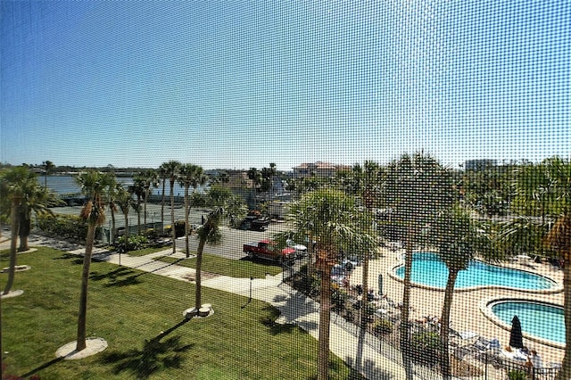 community pool featuring a yard