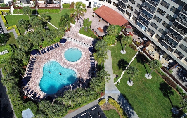 aerial view of property's location featuring a pool area