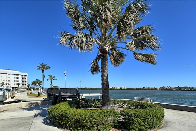 surrounding community featuring a water view