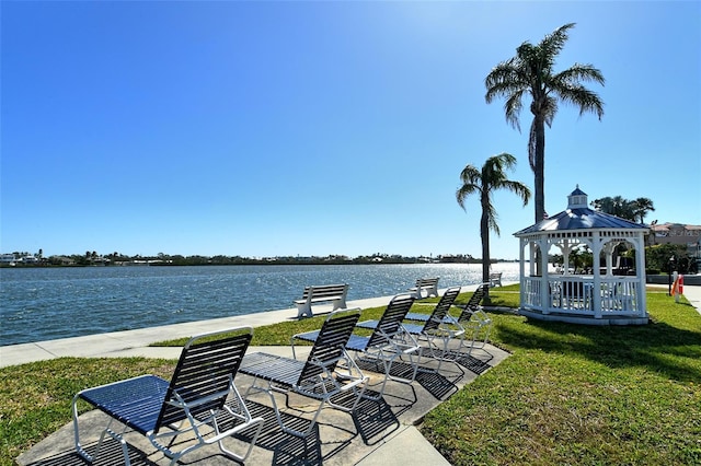 view of patio / terrace with a gazebo and a water view