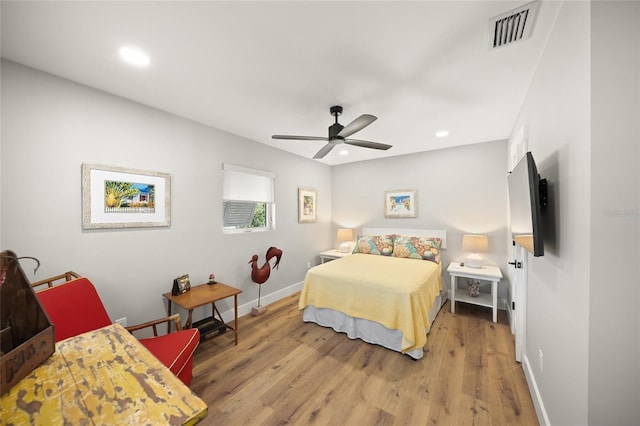 bedroom featuring visible vents, recessed lighting, baseboards, and wood finished floors