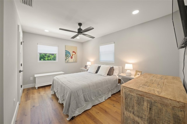 bedroom featuring recessed lighting, visible vents, baseboards, and light wood-style floors