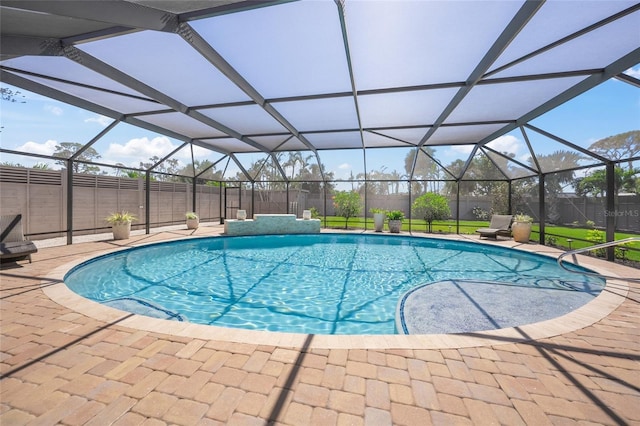 view of swimming pool featuring glass enclosure, a patio, a fenced in pool, and fence