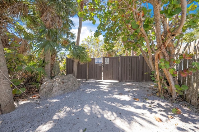 view of gate with fence