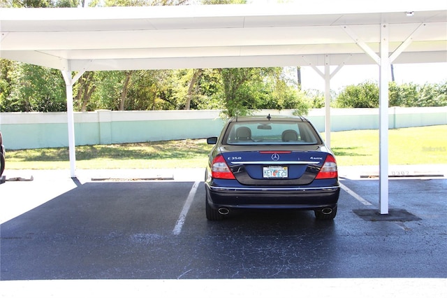 covered parking lot with fence