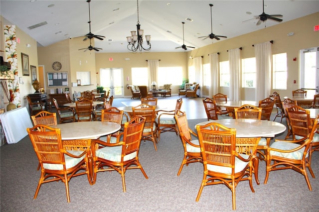 dining room with high vaulted ceiling, visible vents, and a chandelier