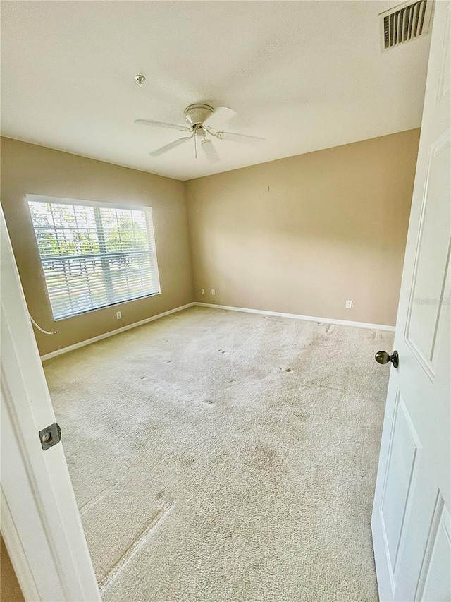 2060 Willow Hammock Cir Unit 201, Punta Gorda, FL 33983 - carpeted spare room featuring baseboards and ceiling fan
