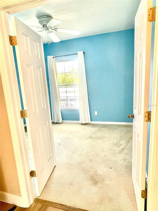 2060 Willow Hammock Cir Unit 201, Punta Gorda, FL 33983 - carpeted empty room with a ceiling fan and baseboards