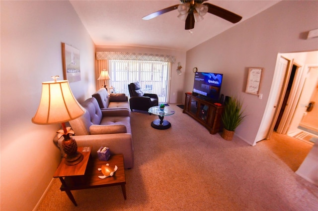 carpeted living area with baseboards, ceiling fan, and vaulted ceiling