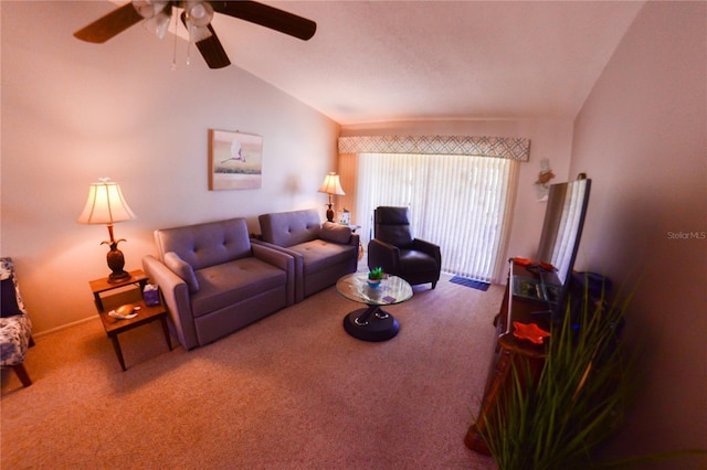 living area featuring vaulted ceiling, carpet flooring, and a ceiling fan