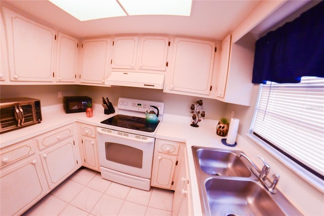 kitchen featuring a sink, light countertops, white cabinets, electric stove, and under cabinet range hood