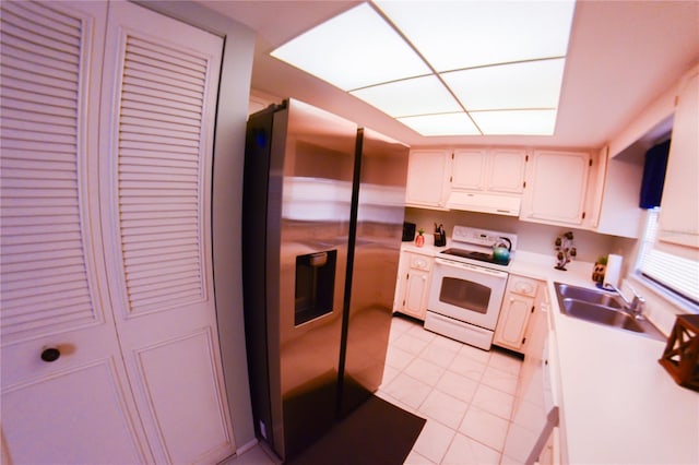 kitchen with stainless steel refrigerator with ice dispenser, white electric range, under cabinet range hood, a sink, and light countertops