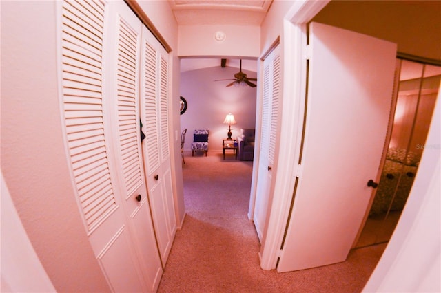 hallway with light colored carpet