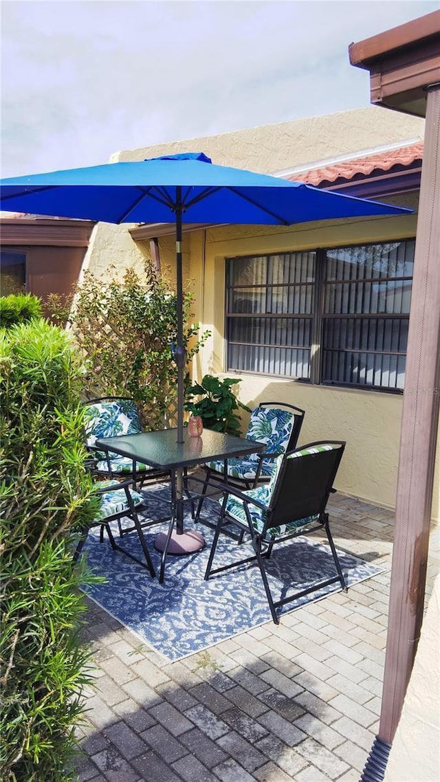 view of patio featuring outdoor dining space