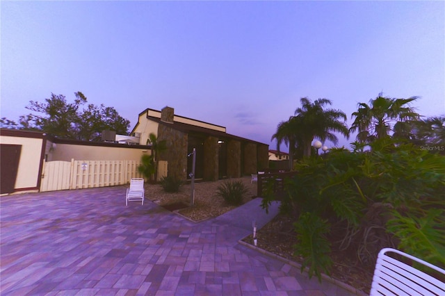 view of patio with a gate and fence