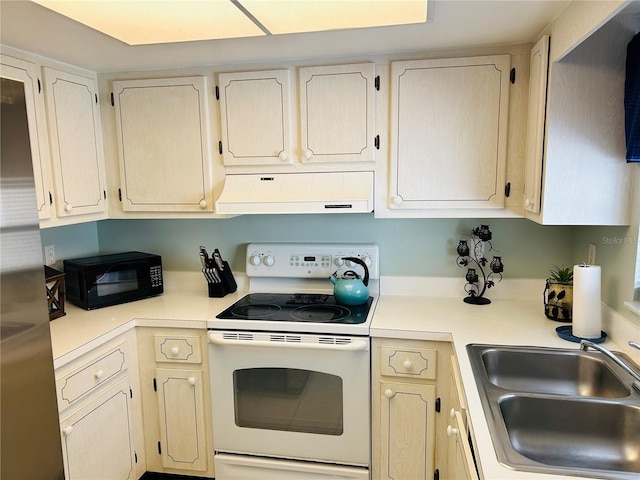 1412 56th St W Unit 1412, Bradenton, FL 34209 - kitchen with white electric range oven, a sink, under cabinet range hood, light countertops, and black microwave