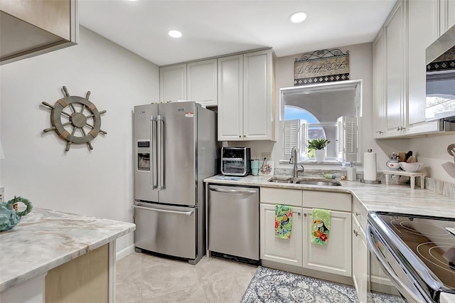3807 41st Street Ct W Unit 52, Bradenton, FL 34205 - kitchen with white cabinets, a sink, stainless steel appliances, and recessed lighting