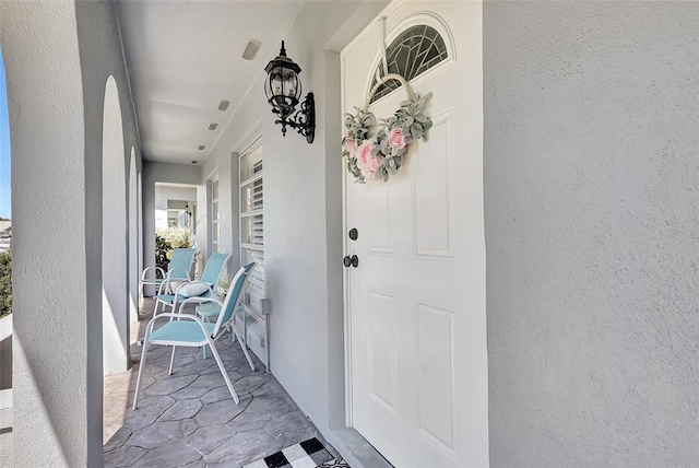 3807 41st Street Ct W Unit 52, Bradenton, FL 34205 - view of exterior entry with covered porch and stucco siding