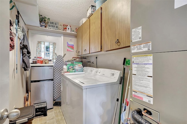 3807 41st Street Ct W Unit 52, Bradenton, FL 34205 - laundry room featuring a textured ceiling, cabinet space, heating unit, and separate washer and dryer