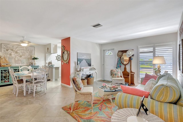 3807 41st Street Ct W Unit 52, Bradenton, FL 34205 - living room featuring a ceiling fan, light tile patterned floors, baseboards, and visible vents