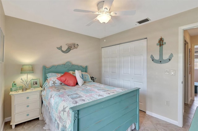 3807 41st Street Ct W Unit 52, Bradenton, FL 34205 - bedroom with a closet, a ceiling fan, light tile patterned floors, baseboards, and visible vents