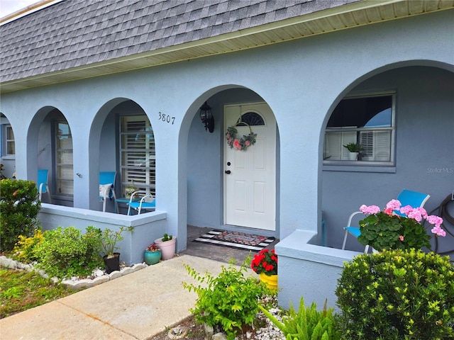 3807 41st Street Ct W Unit 52, Bradenton, FL 34205 - entrance to property featuring a shingled roof and stucco siding