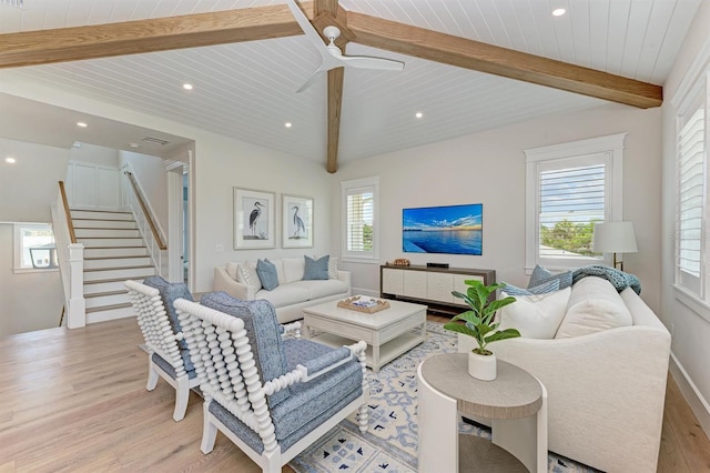 living room with recessed lighting, beamed ceiling, light wood-style floors, and stairway