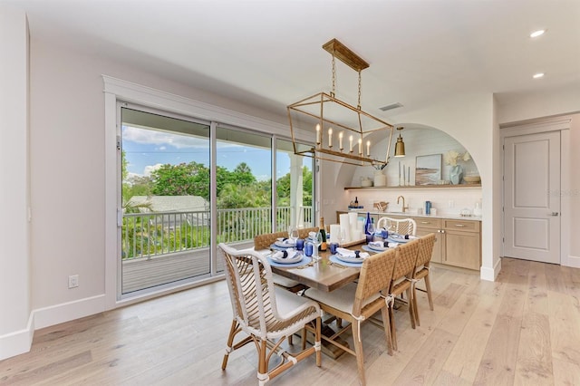 dining area featuring visible vents, baseboards, a chandelier, light wood-type flooring, and recessed lighting