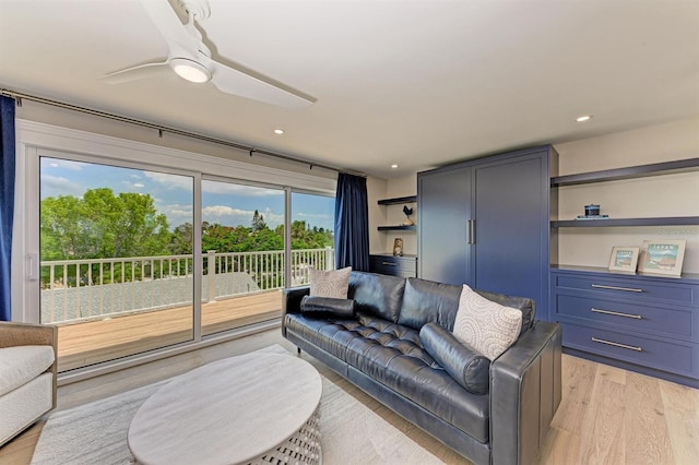 living area featuring recessed lighting, light wood-type flooring, and ceiling fan