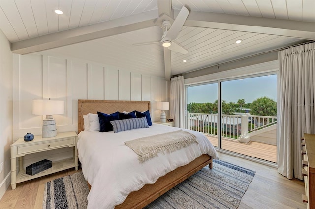 bedroom featuring lofted ceiling with beams, wood finished floors, access to exterior, and wooden ceiling