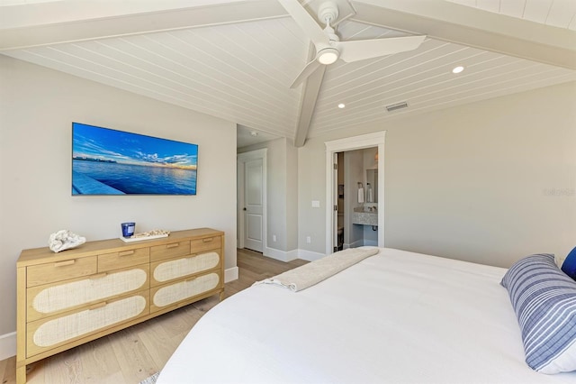 bedroom featuring a ceiling fan, wood finished floors, visible vents, baseboards, and vaulted ceiling with beams