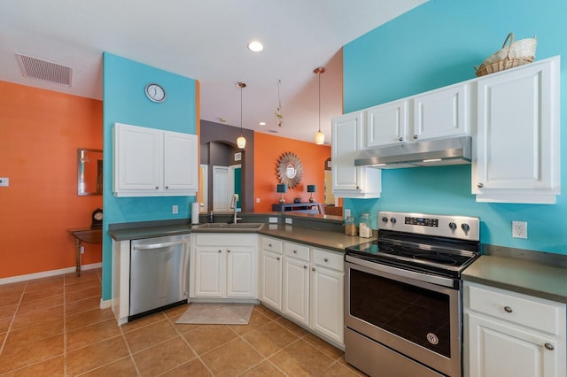 kitchen with dark countertops, visible vents, appliances with stainless steel finishes, a sink, and under cabinet range hood