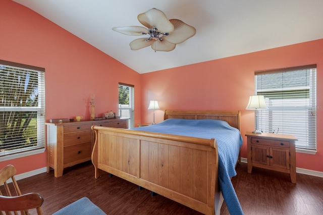 bedroom with a ceiling fan, baseboards, vaulted ceiling, and wood finished floors