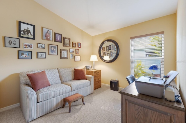 office with light carpet, vaulted ceiling, and baseboards