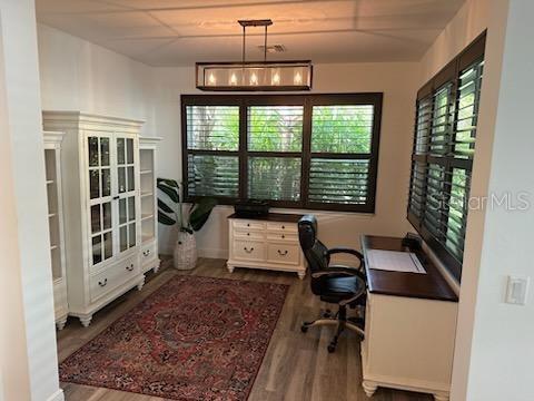 office with dark wood finished floors