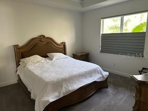 carpeted bedroom with baseboards