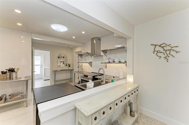 kitchen featuring baseboards, island range hood, decorative backsplash, electric stove, and recessed lighting