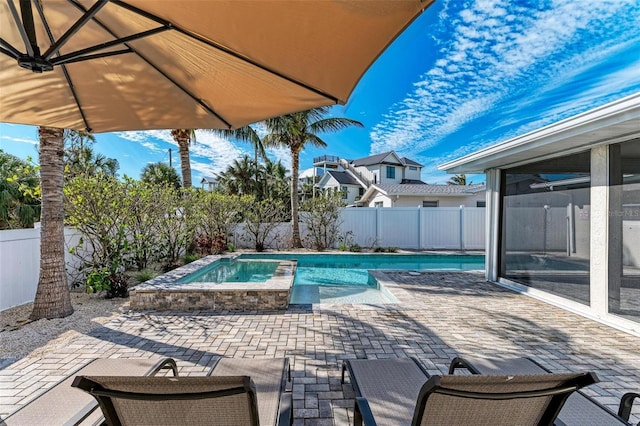 view of swimming pool with a fenced backyard, a fenced in pool, and a patio