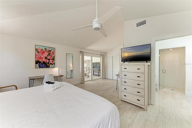 bedroom with a ceiling fan, visible vents, vaulted ceiling, and light wood finished floors