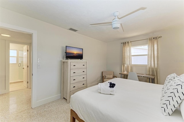 bedroom featuring light speckled floor, ceiling fan, visible vents, and baseboards