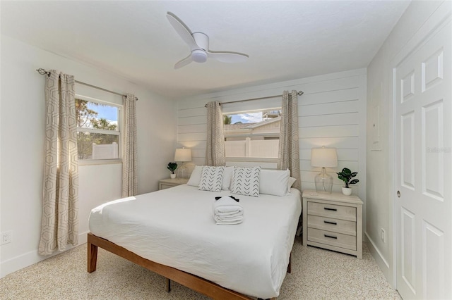 bedroom featuring a ceiling fan and baseboards