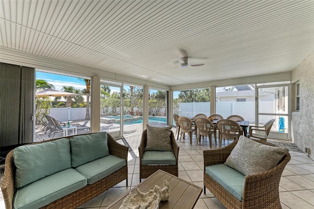 sunroom / solarium with ceiling fan