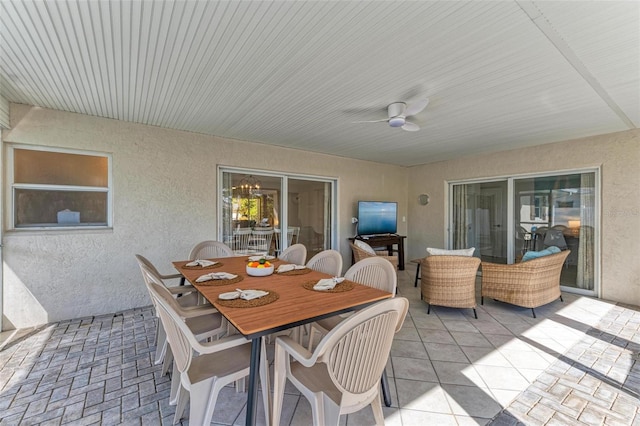 view of patio / terrace with ceiling fan and outdoor dining space