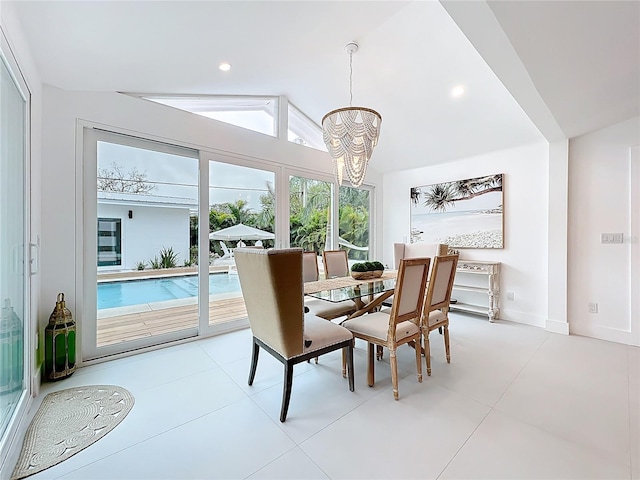 dining space featuring lofted ceiling, recessed lighting, a chandelier, and baseboards