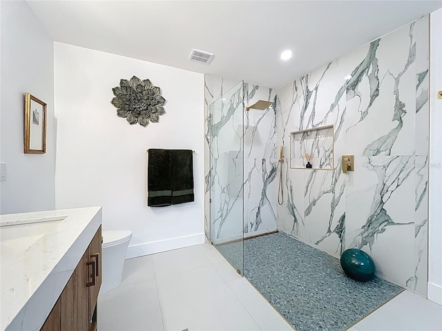 full bathroom with a marble finish shower, visible vents, toilet, tile patterned floors, and vanity